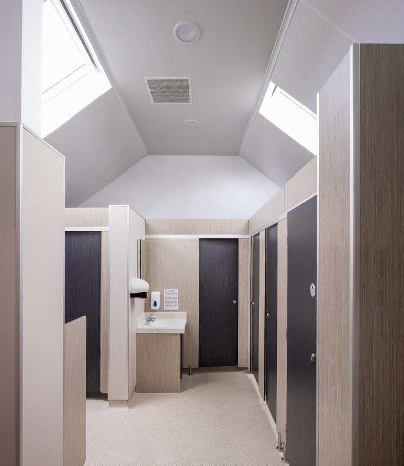 commercial washroom in wooden finish